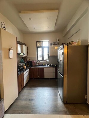 Kitchen in 3 BHK Builder Floor at Aman Luxury Apartments, Sahastradhara Road – for Sale