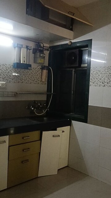 Kitchen in 2 BHK Builder Floor at Shantinagar CHS, Mira Road – for Rent