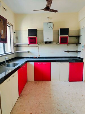 Kitchen in 2 BHK Apartment at Swastik Regalia, Waghbil – for Rent