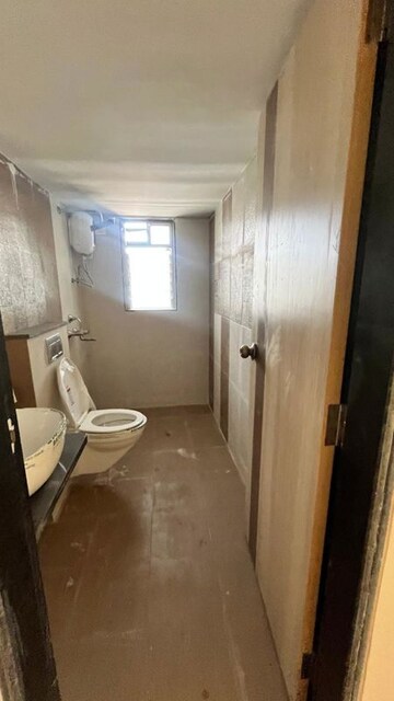 Bathroom in 2 BHK Apartment at Lalani Residency, Kavesar – for Sale