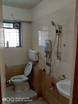 Bathroom in 2 BHK Apartment at Shree Tirupati STG Signature Residency, Patlipada – for Rent