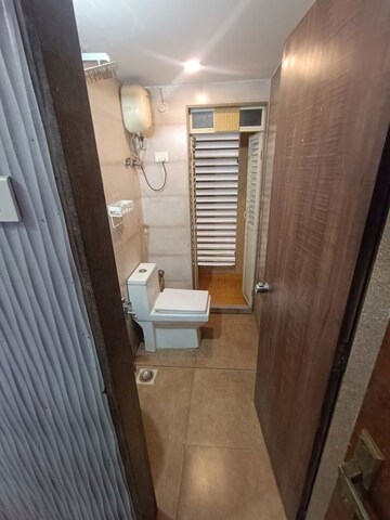 Bathroom in 1.5 BHK Apartment at Juhi Lawns, Seawoods – for Rent