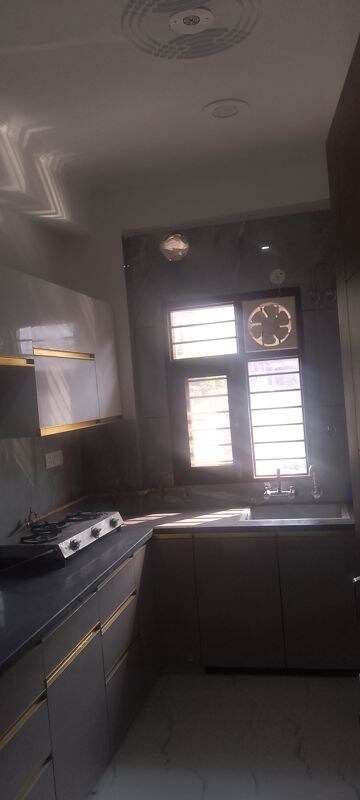 Kitchen in 2 BHK Builder Floor at Arun Yamuna Enclave, Sector 30 – for Rent