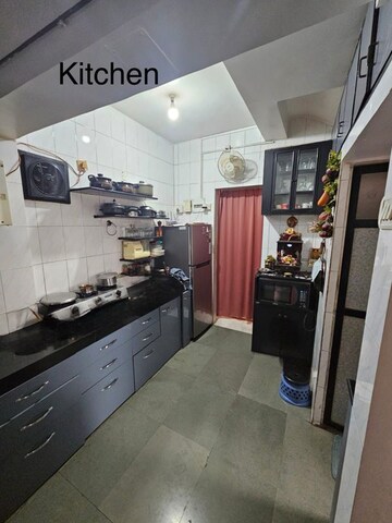 Kitchen in 2 BHK Apartment at Metropolis Rivera, Kasarvadavali – for Rent