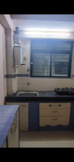 Kitchen in 2 BHK Apartment at Divya Smruthi, Malad West – for Rent