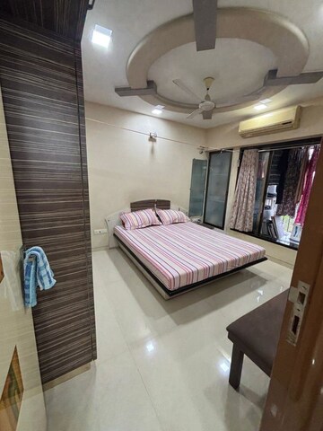 Bedroom in 3 BHK Apartment at Adarsh Whispering Wind CHS, Malad West – for Rent