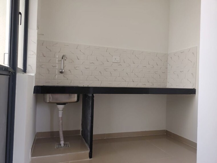 Kitchen, peninsula-address-one-phase-5 3 Bedroom 653 Sq.Ft. Apartment In Gahunje Pune 9916413