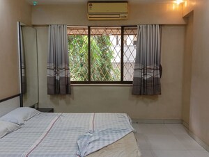 Bedroom in 2 BHK Apartment at Vastu Tower, Malad West – for Rent