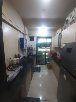 Kitchen in 2 BHK Apartment at Jalan Aura County Pune, Wagholi – for Rent