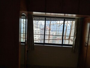 Room in 2 BHK Apartment at Atul Blue Horizon II, Malad West – for Rent