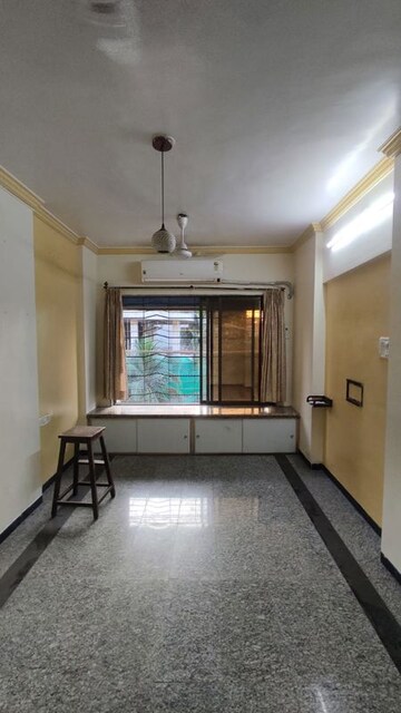 Living Room in 2 BHK Apartment at Malad SC CHS, Malad West – for Rent