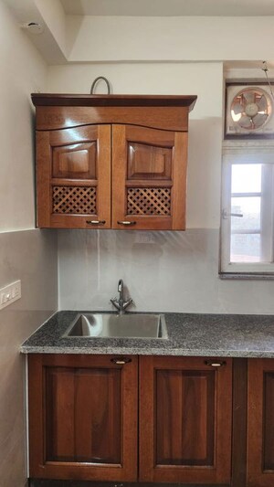 Kitchen in 3 BHK Apartment at Ansal Housing Woodbury, Patiala Road – for Rent