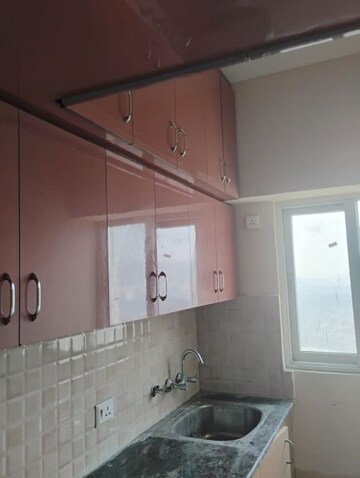 Kitchen in 1 BHK Apartment at Amrapali Dream Valley, Tech Zone 4 Greater Noida – for Rent