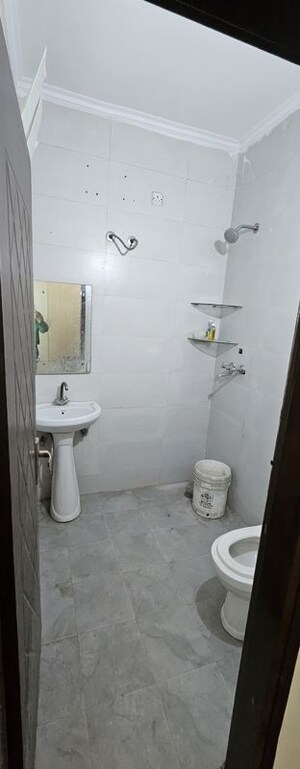 Bathroom in 3 BHK Builder Floor at Shri Devaji Residency, Dhakoli – for Sale