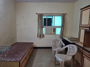 Living Room in 1.5 BHK Apartment at STC Employees CHS, Andheri East – for Rent