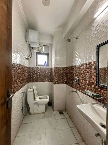 Bathroom in 1 BHK Builder Floor at Risland Sky Mansion, Chattarpur – for Rent