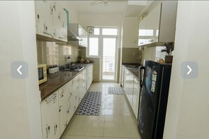 Kitchen in 3.5 BHK Apartment at Emaar Palm Gardens, Sector 83 – for Sale