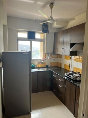 Kitchen in 2 BHK Apartment at Rustomjee Urbania Aurelia, Thane West – for Rent