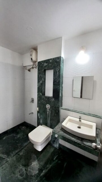 Bathroom in 1 BHK Apartment at Unnati Woods CHS, Kasarvadavali – for Rent