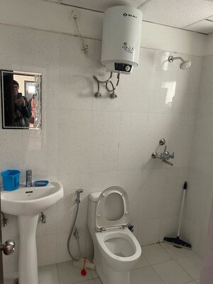 Bathroom in 2 BHK Apartment at Urban Axis Urban Woods, Sushant Golf City – for Rent