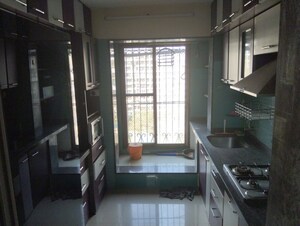 Kitchen in 3 BHK Apartment at Tharwani Rosewood Heights, Kharghar Sector 10 – for Rent