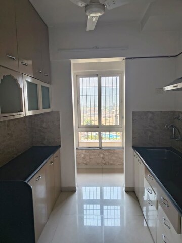 Kitchen in 1 BHK Apartment at Puranik Rumah Bali, Ghodbunder Road – for Rent