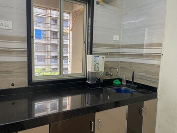Kitchen in 1.5 BHK Apartment at Kalpa Taru Siddhachal V, Kasarvadavali – for Rent