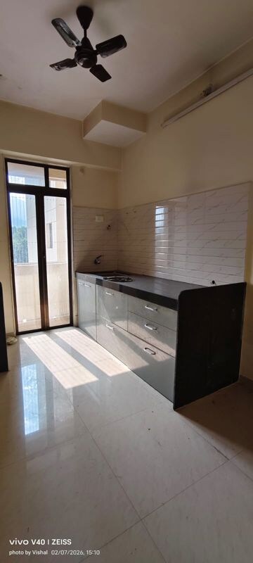 Kitchen in 2 BHK Apartment at Ram Pushpanjali Residency, Owale – for Rent