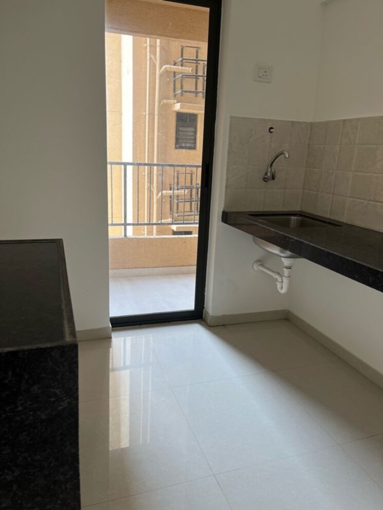 Kitchen, shapoorji-pallonji-joyville-hadapsar-annexe 2 Bedroom 726 Sq.Ft. Apartment In Hadapsar Pune 9921449