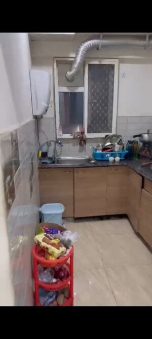 Kitchen in 2 BHK Apartment at Gaur Atulyam, Omicron I Greater Noida – for Rent