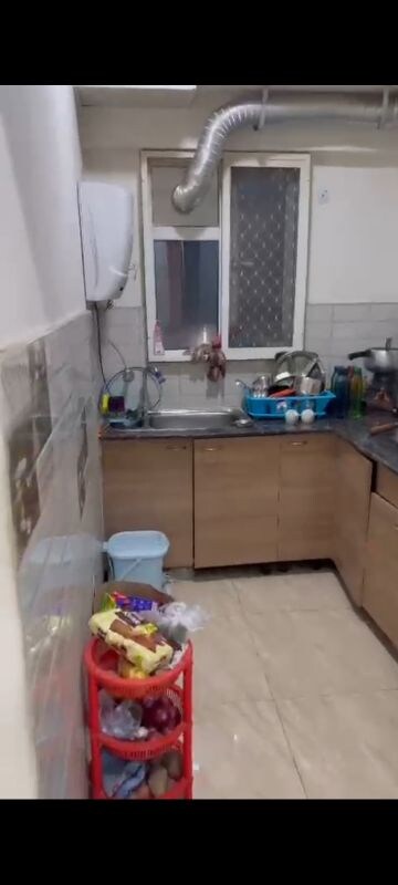 Kitchen in 2 BHK Apartment at Gaur Atulyam, Omicron I Greater Noida – for Rent