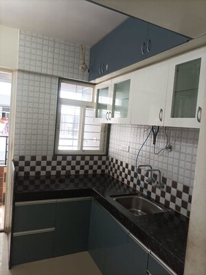 Kitchen in 2 BHK Apartment at Tanish Park, Charholi Budruk – for Rent