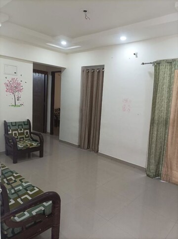 Living Room in 2 BHK Apartment at Tanish Park, Charholi Budruk – for Rent