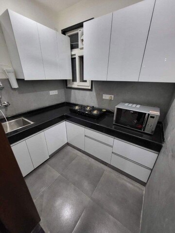 Kitchen in 1 RK Apartment at Paras Tierea, Sector 137 – for Rent