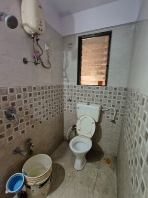 Bathroom in 1 BHK Apartment at Puranik Hometown, Ghodbunder Road – for Rent