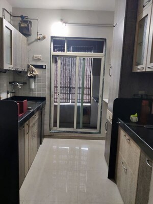 Kitchen in 2 BHK Apartment at Sadguru Garden CHS, Ghodbunder Road – for Rent