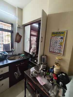 Kitchen in 1 BHK Apartment at Raunak Unnathi Greens, Kasarvadavali – for Sale