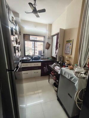 Kitchen in 1 BHK Apartment at Raunak Unnathi Greens, Kasarvadavali – for Sale