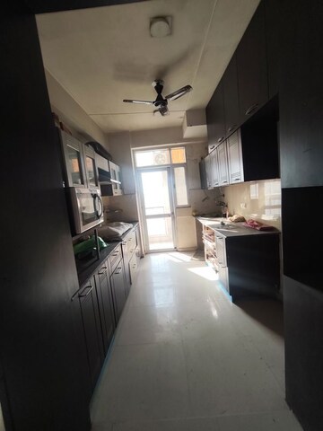 Kitchen in 4 BHK Apartment at Prateek Wisteria, Sector 77 – for Sale