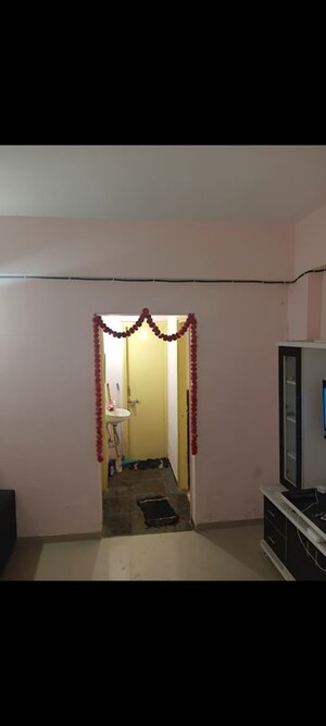 Living Room in 1 BHK Apartment at Applewood Satyesh Residency, Shela – for Rent