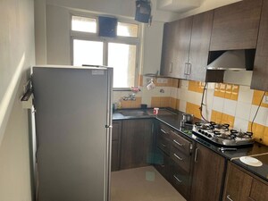 Kitchen in 2 BHK Apartment at Lalani Residency, Kavesar – for Rent