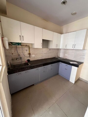 Kitchen in 2 BHK Apartment at Ajnara Le Mart, Sector 16b Greater Noida – for Sale