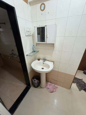 Bathroom in 1 BHK Apartment at Nandini CHS, Andheri West – for Sale