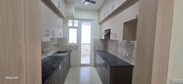 Kitchen in 2.5 BHK Apartment at Amrapali Heartbeat City, Sector 107 – for Rent