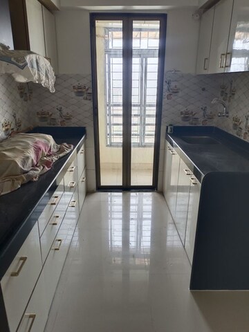 Kitchen in 1.5 BHK Apartment at Hubtown Greenwoods, Vartak Nagar – for Sale