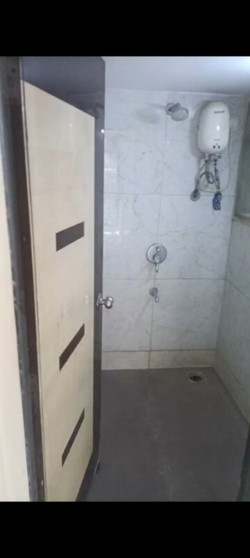 Bathroom in 2 BHK Apartment at RNA NG Canary, Mira Road – for Sale
