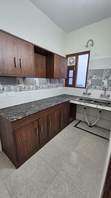 Kitchen in 2 BHK Apartment at Amrapali Heartbeat City, Sector 107 – for Rent