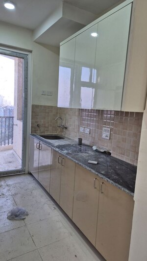 Kitchen in 3 BHK Apartment at Amrapali Heartbeat City, Sector 107 – for Rent