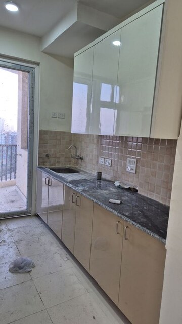 Kitchen in 3 BHK Apartment at Amrapali Heartbeat City, Sector 107 – for Rent