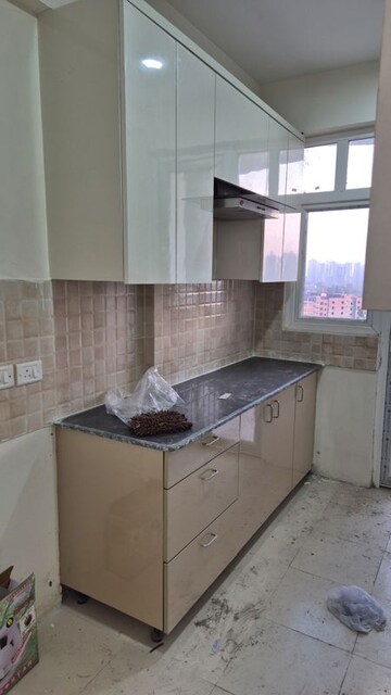 Kitchen in 3 BHK Apartment at Amrapali Heartbeat City, Sector 107 – for Rent